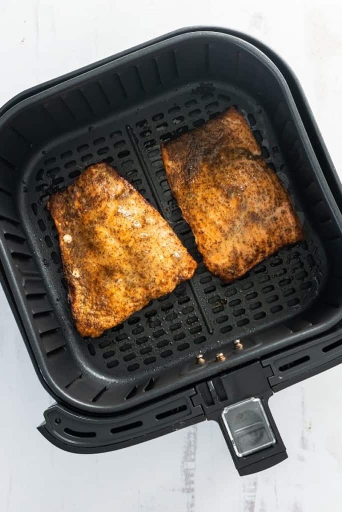 flip salmon fillets to cook evenly in air fryer