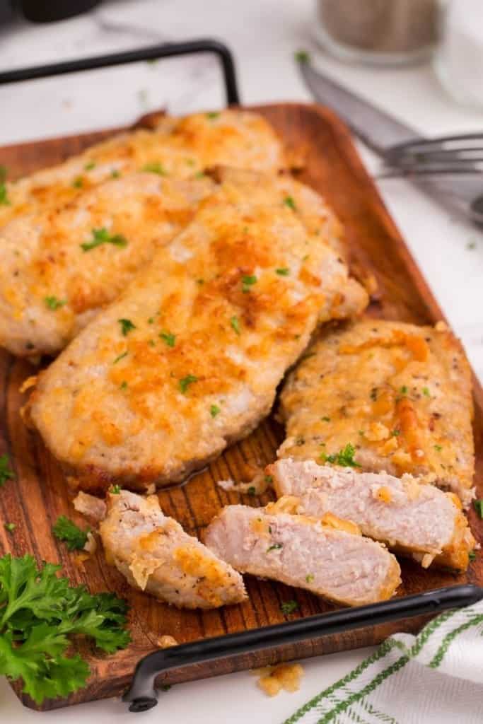 air fryer boneless pork chops sliced and on cutting board