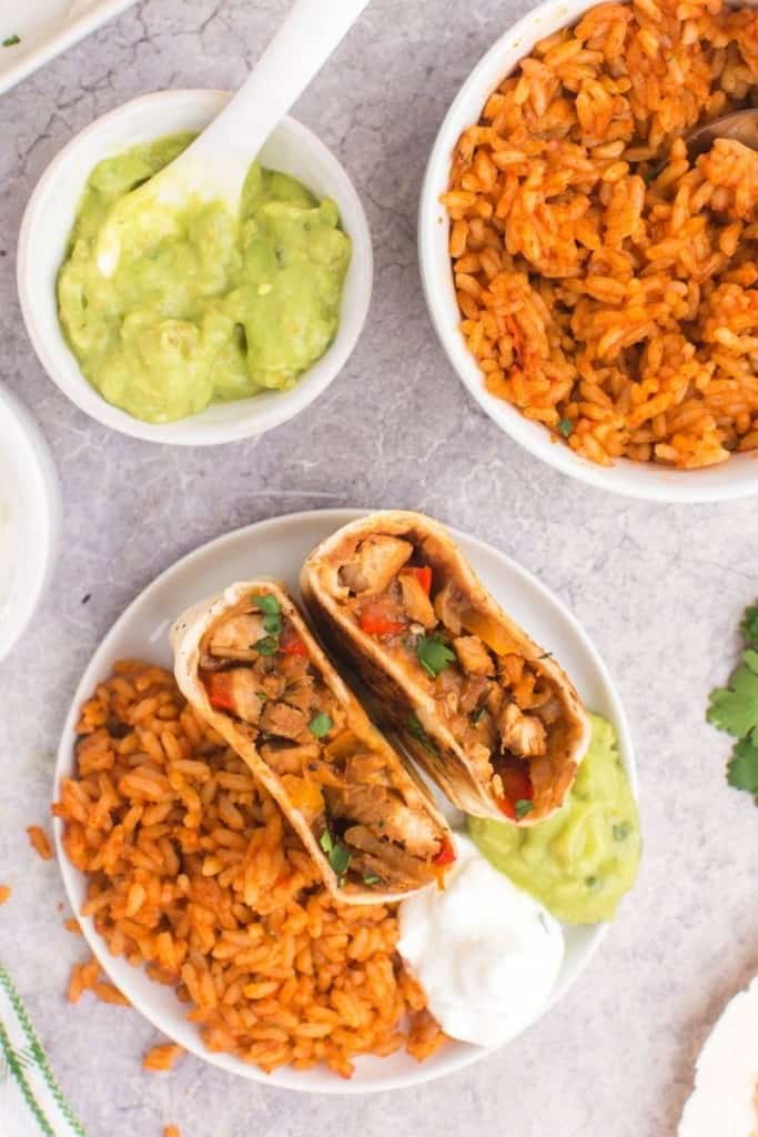 chicken fajita wraps with Spanish rice and guacamole