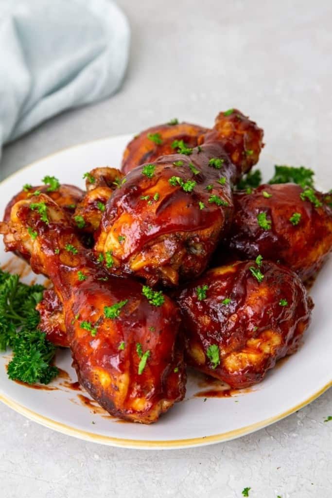 instant pot chicken drumsticks with bbq sauce on white plate