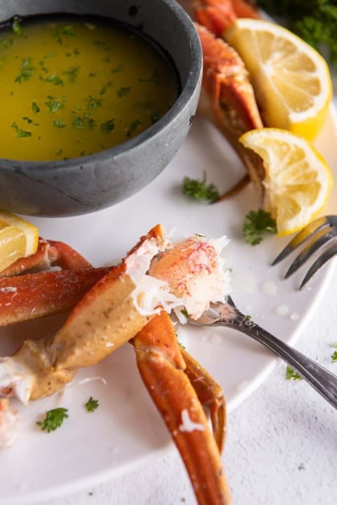 fork with piece of crab leg cooked in instant pot