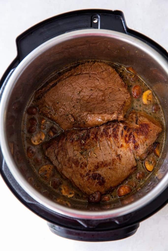 nestle the beef in the reserved marinade in instant pot