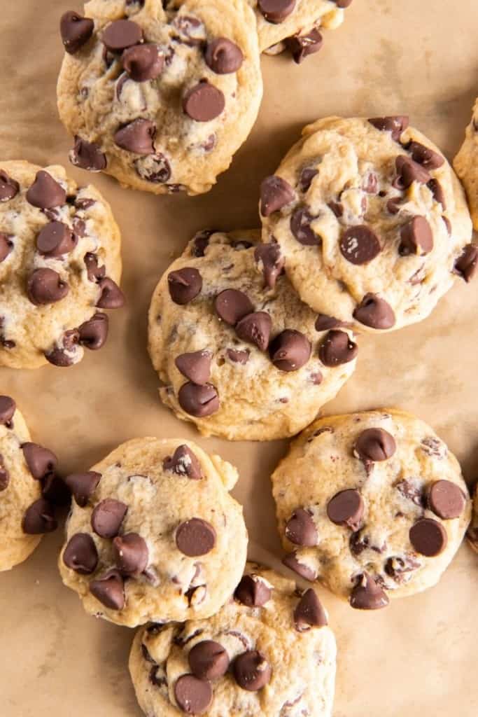 several chocolate chip cookies on parchment paper