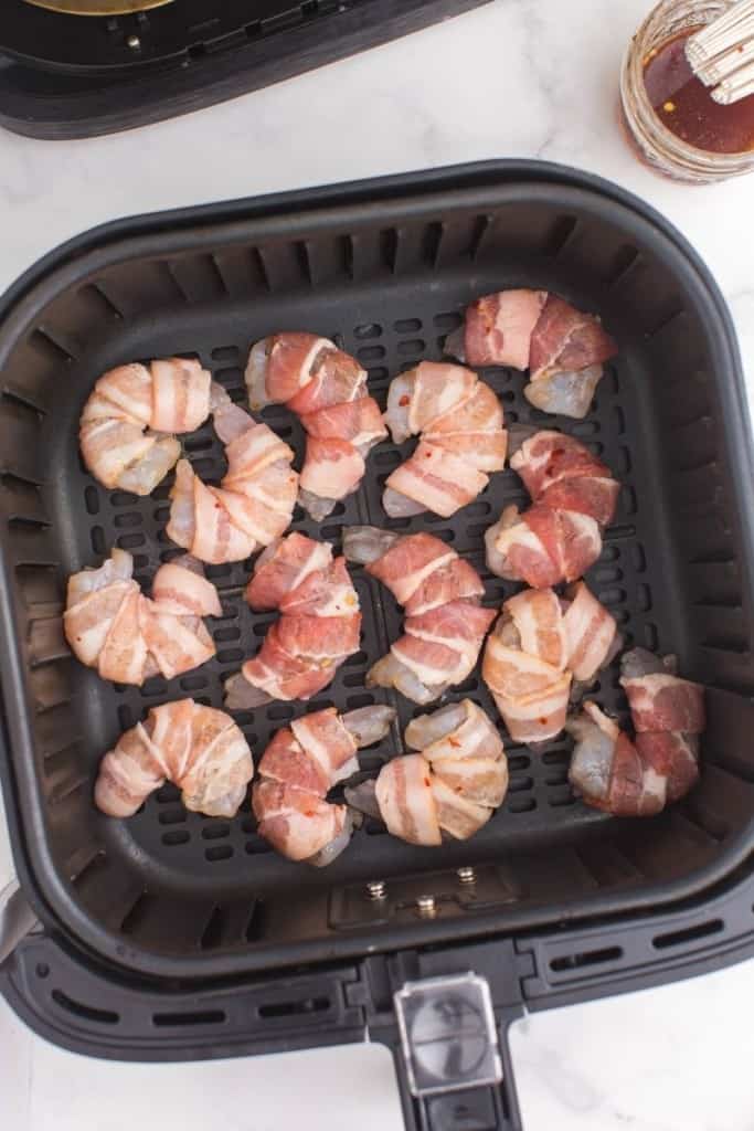 place bacon-wrapped shrimp in single layer in air fryer