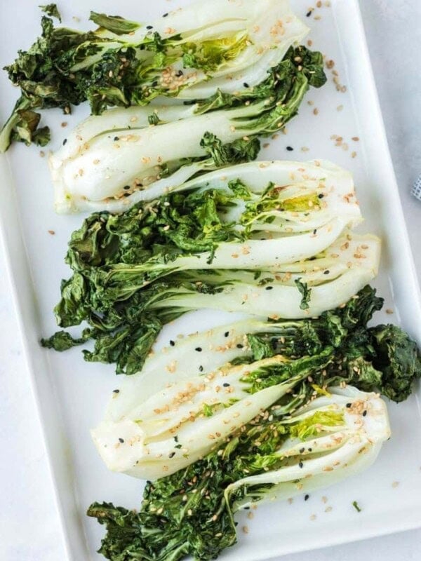 Seasoned air fryer bok choy on white plate