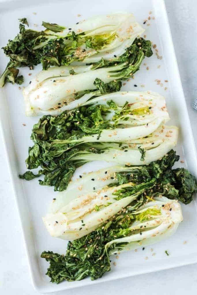 Seasoned air fryer bok choy on white plate