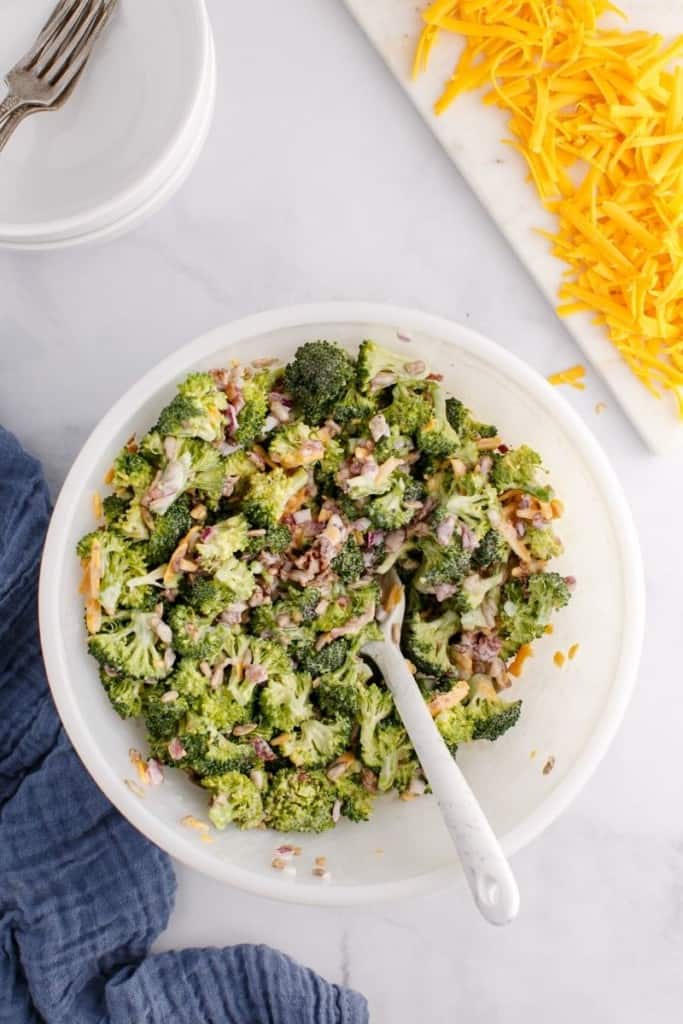bowl of broccoli salad with spoon