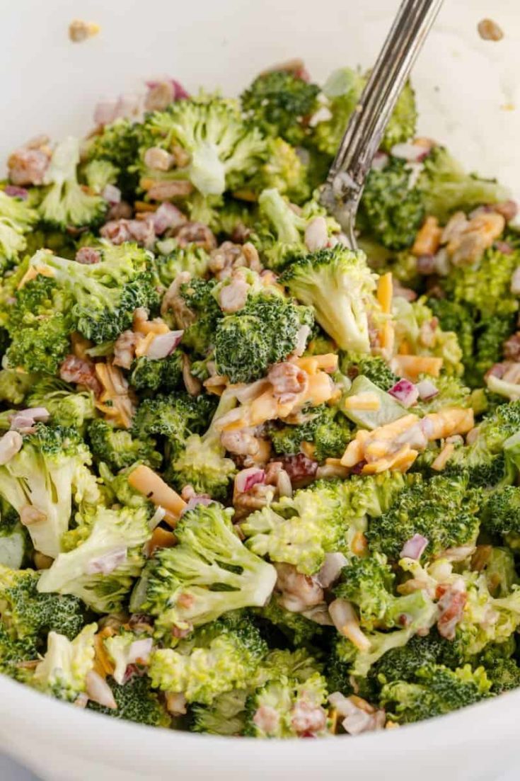 close up photo of broccoli salad with fork