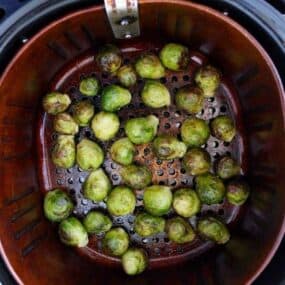 Cooked brussel sprouts in air fryer basket