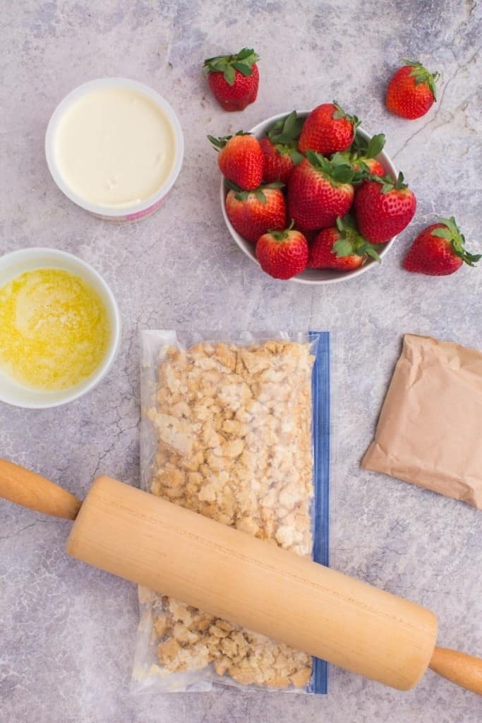 use rolling pin to crumble golden Oreos in Ziploc bag