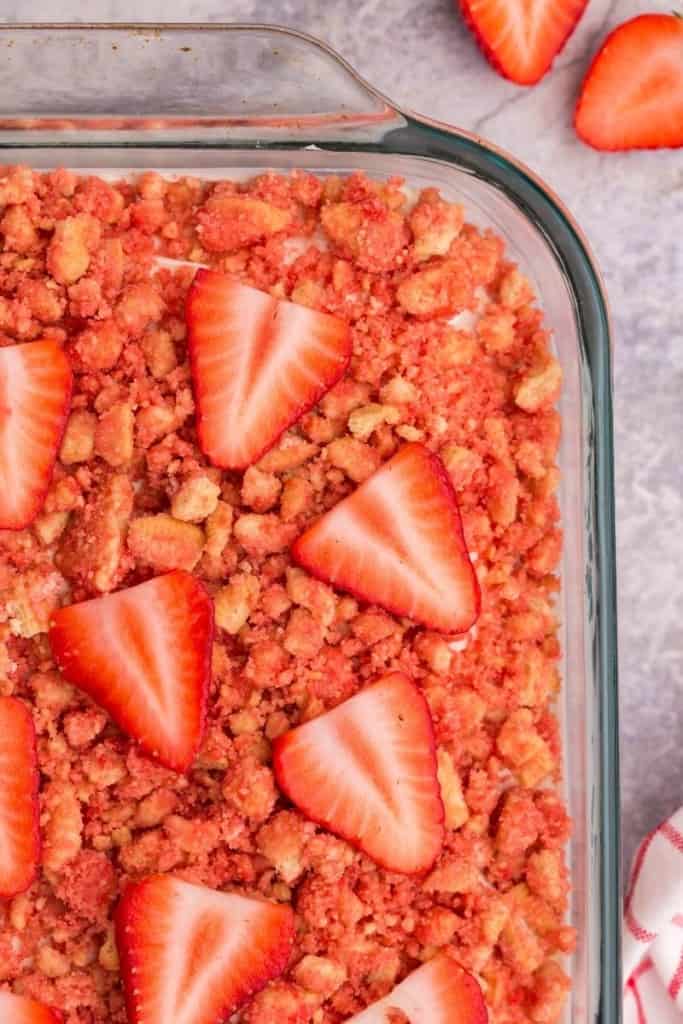 close up of strawberry shortcake crumble with Oreo pieces and strawberry slices