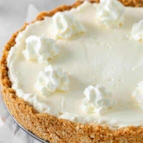 5 ingredient no-bake cheesecake with whipped cream dollops