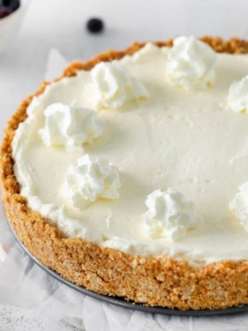 5 ingredient no-bake cheesecake with whipped cream dollops