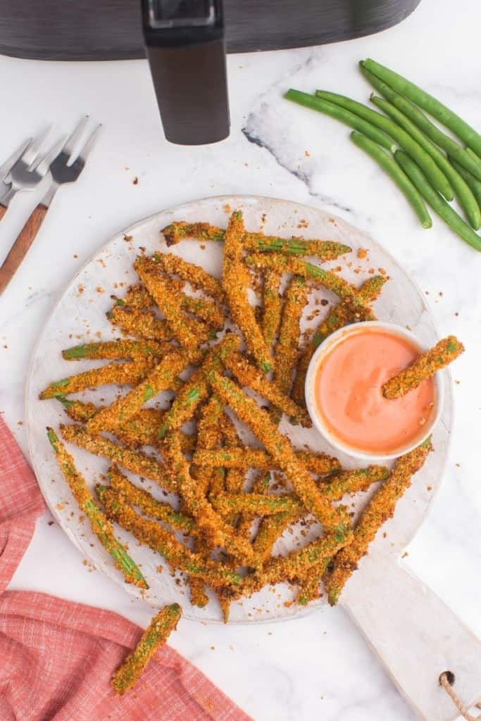 plate with air fryer green bean fries and dipping sauce