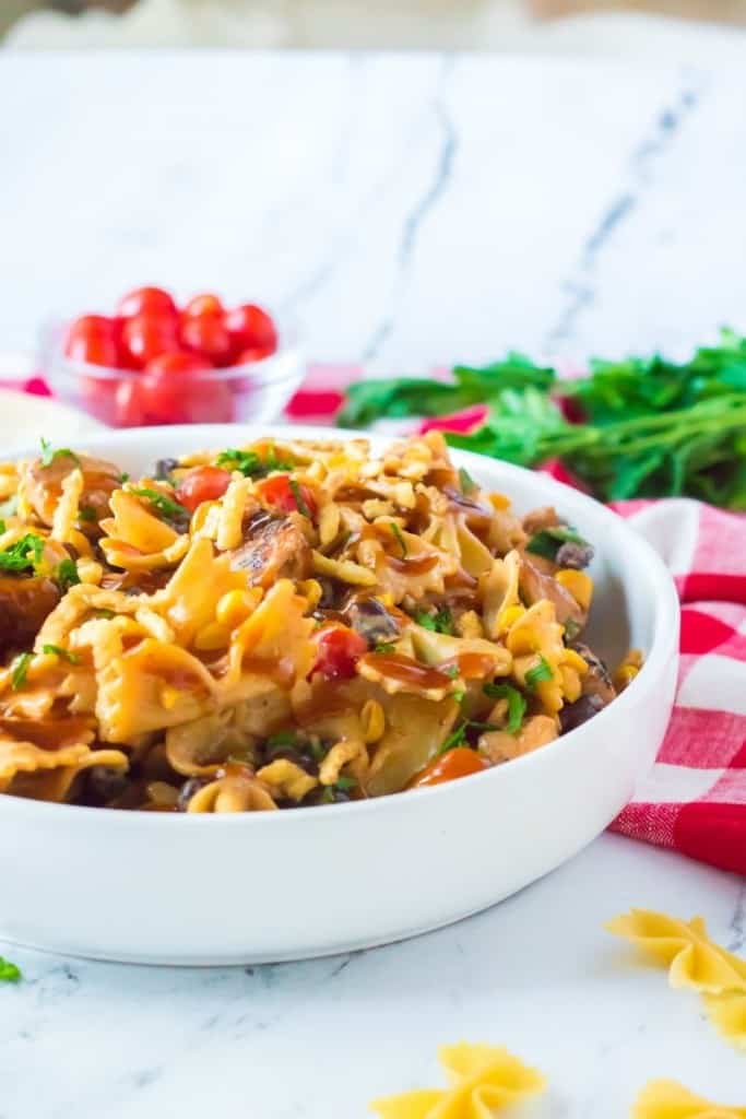 white serving bowl of BBQ chicken salad