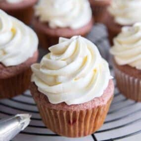cream cheese frosting without butter on platter of cupcakes