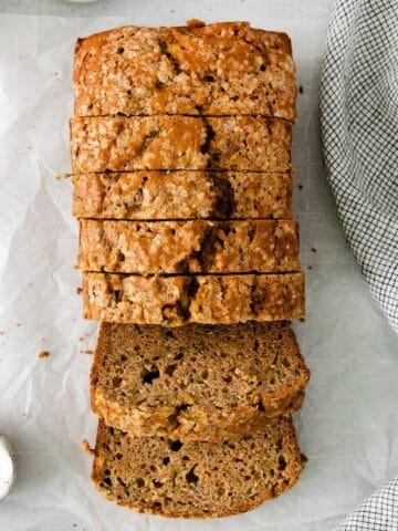 Close up of the zucchini bread sliced on a counter.