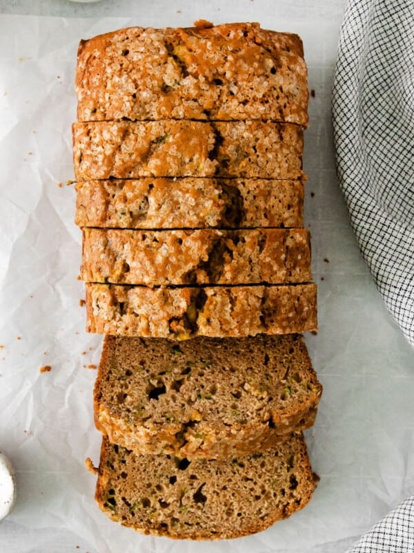 Close up of the zucchini bread sliced on a counter.