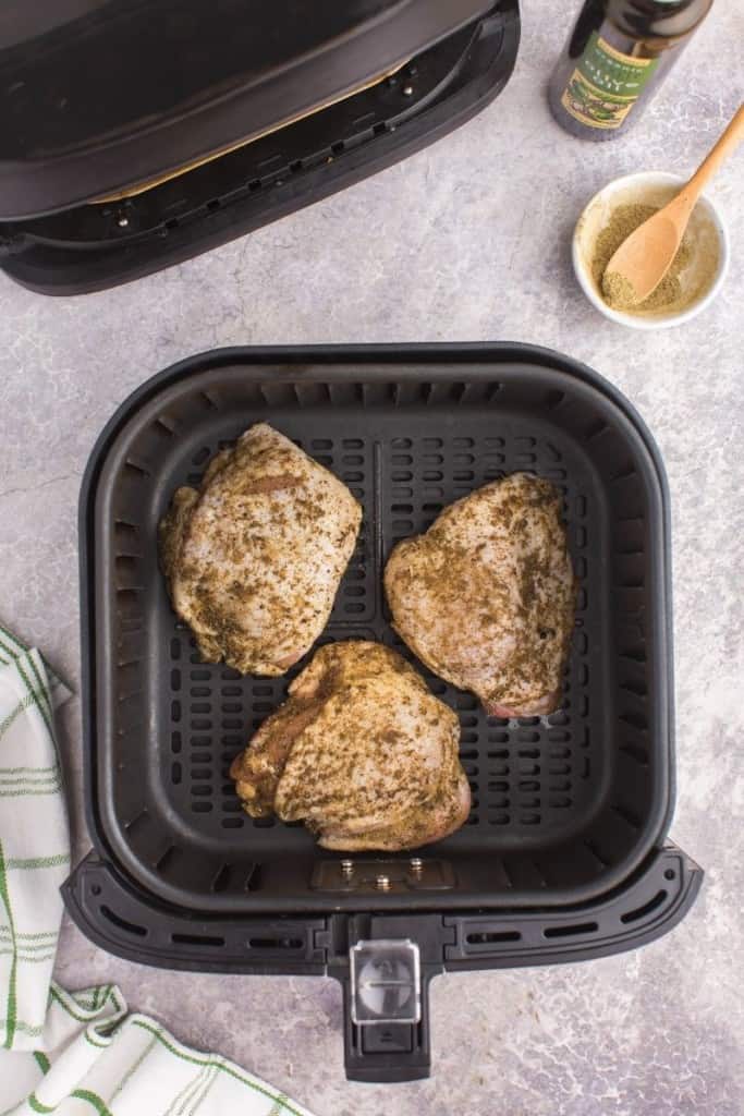 cook chicken thighs in single layer in air fryer basket