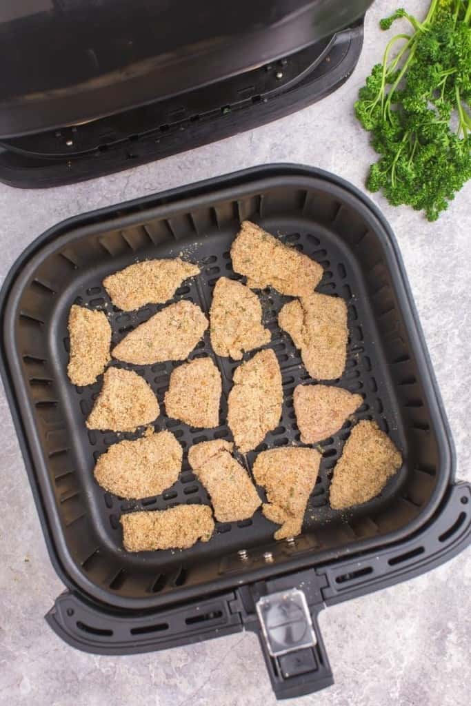 place seasoned chicken nuggets in single layer in air fryer