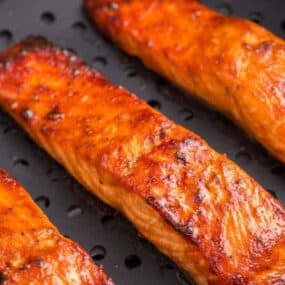 teriyaki salmon filets cooking in air fryer