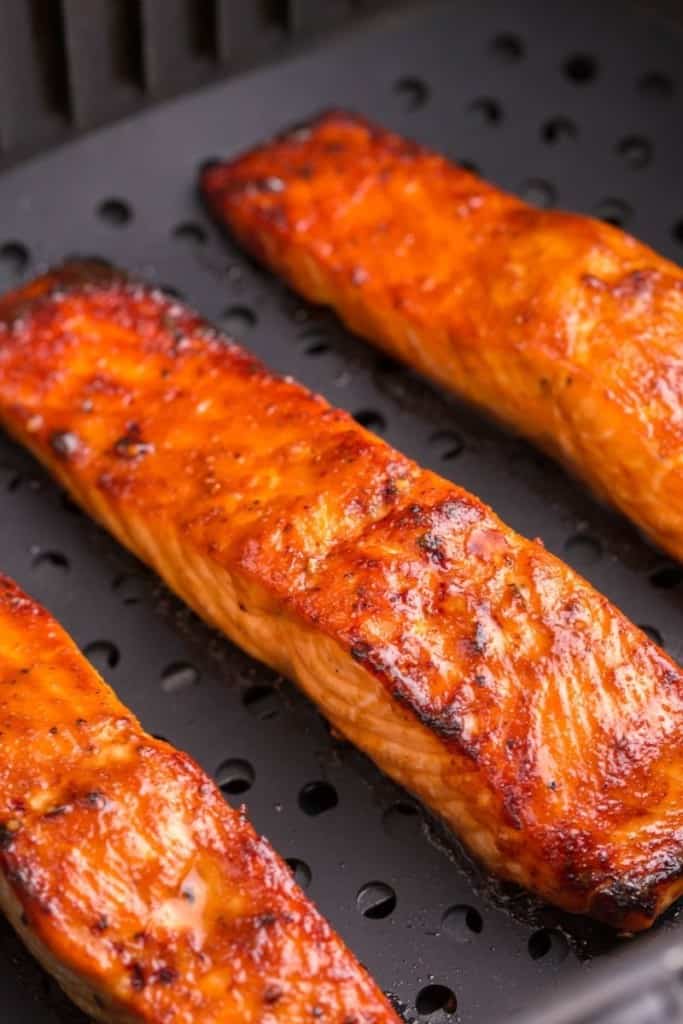 teriyaki salmon filets cooking in air fryer