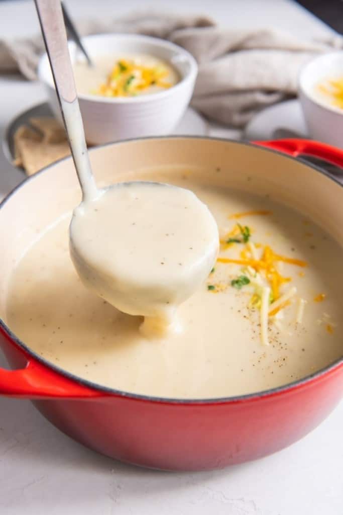 Spoon dishing up some 4 ingredient potato soup