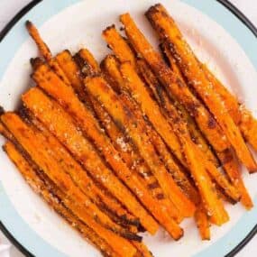 White plate full of air fryer carrot fries