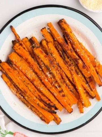 White plate full of air fryer carrot fries