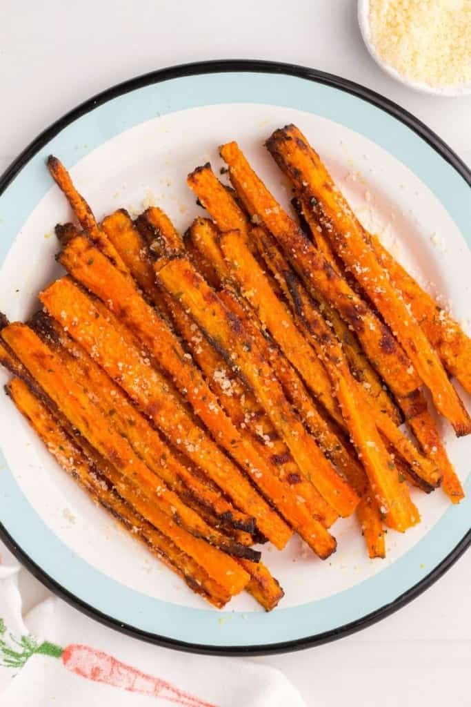 White plate full of air fryer carrot fries