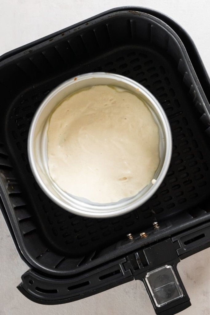 pour batter into 6-inch cake pan inside air fryer