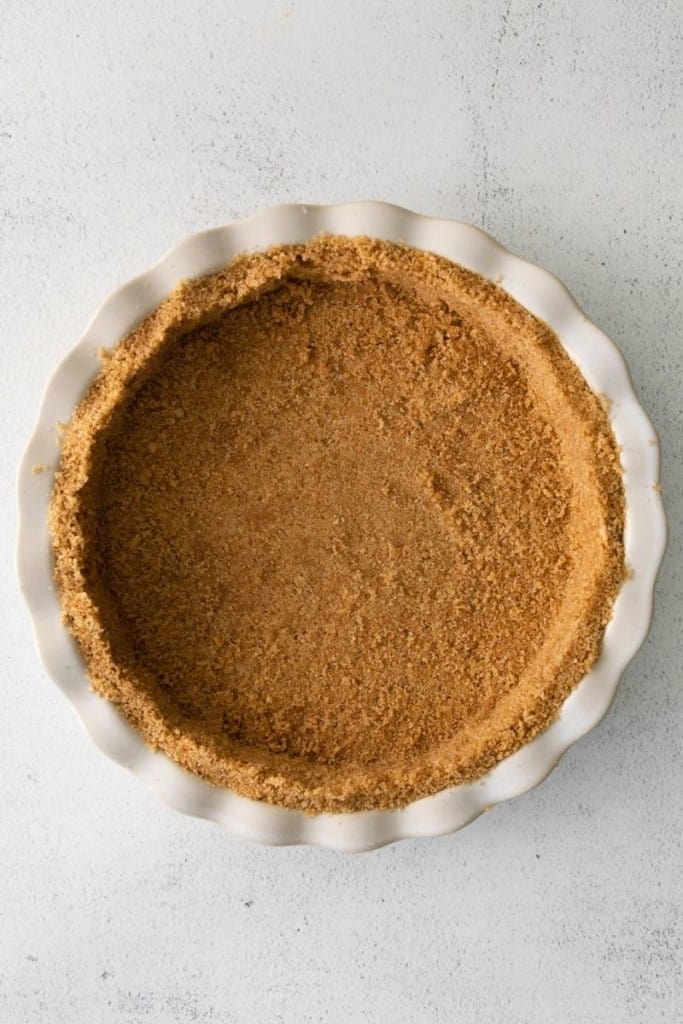 press graham cracker crust into pie pan