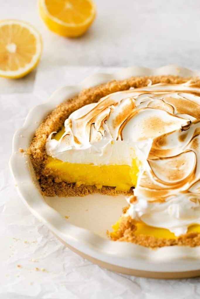 lemon meringue pie with piece taken out