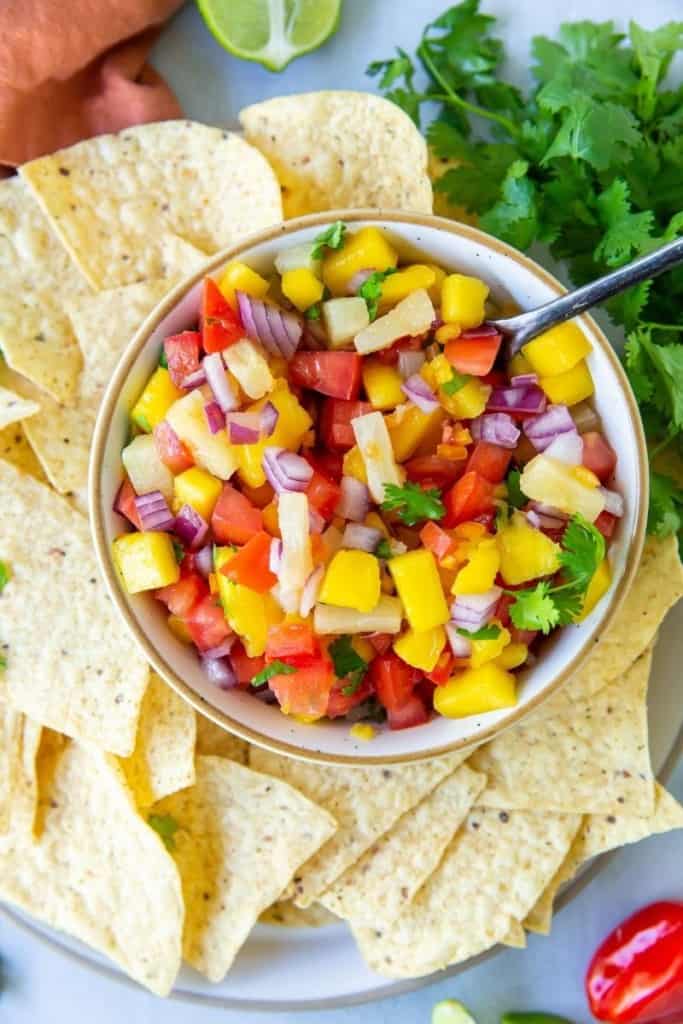 plate of tortilla chips with mango habanero salsa on side