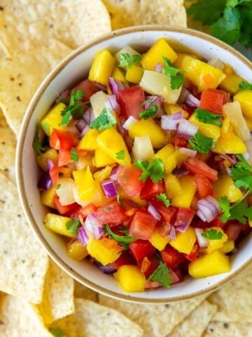 Overhead view of the salsa in a serving bowl with tortilla chips around it.