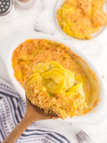 overhead view of spatula dishing up some squash casserole