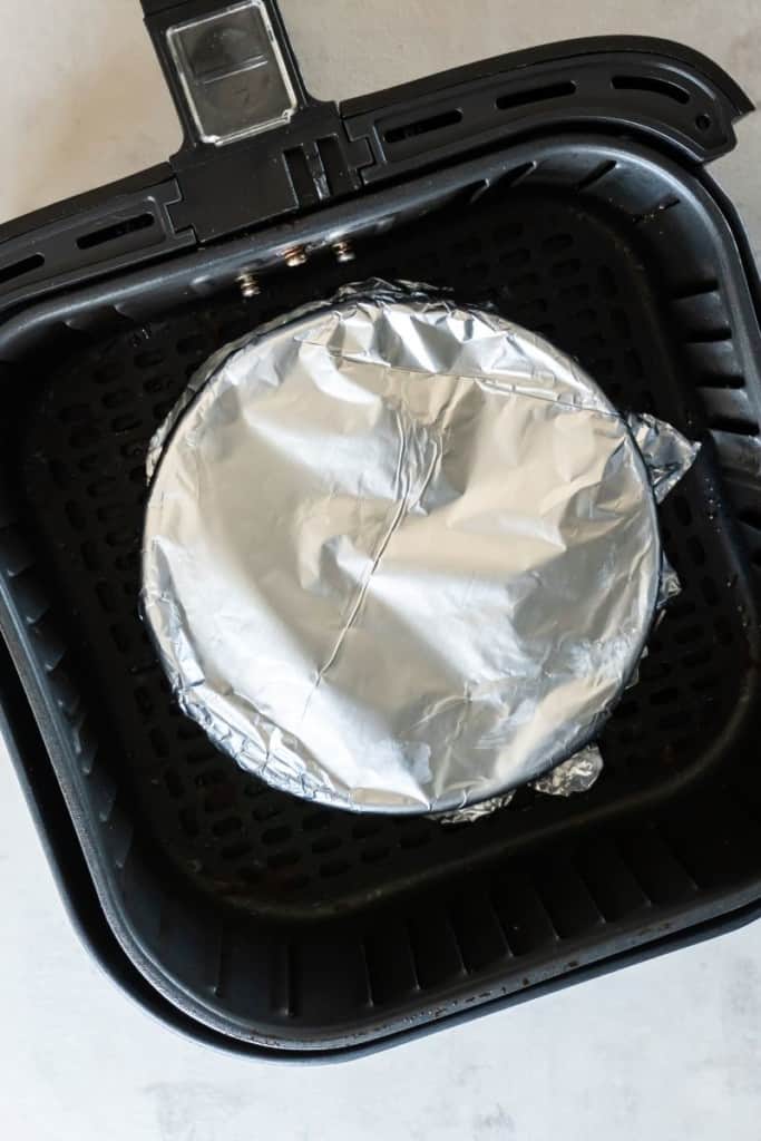 cover rice with aluminum foil and put into air fryer