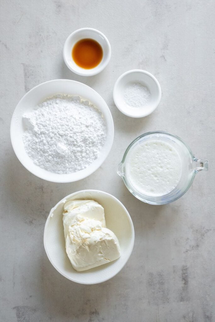 Ingredients to make cream cheese frosting without butter: heavy cream, cream cheese, powdered sugar, vanilla, and salt.