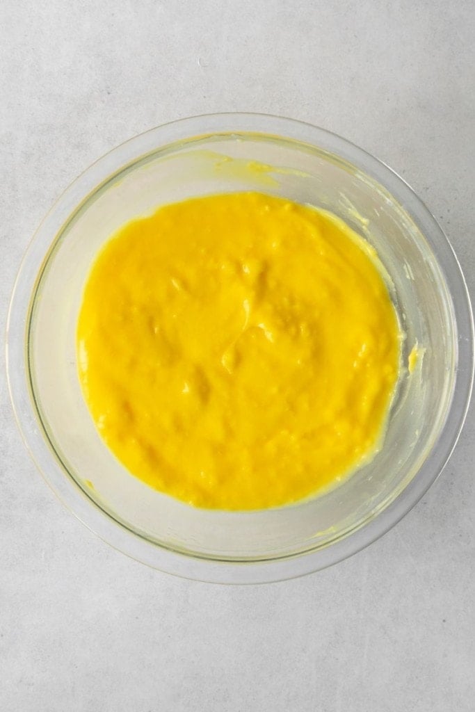Lemon jello mixture mixed in a clear bowl