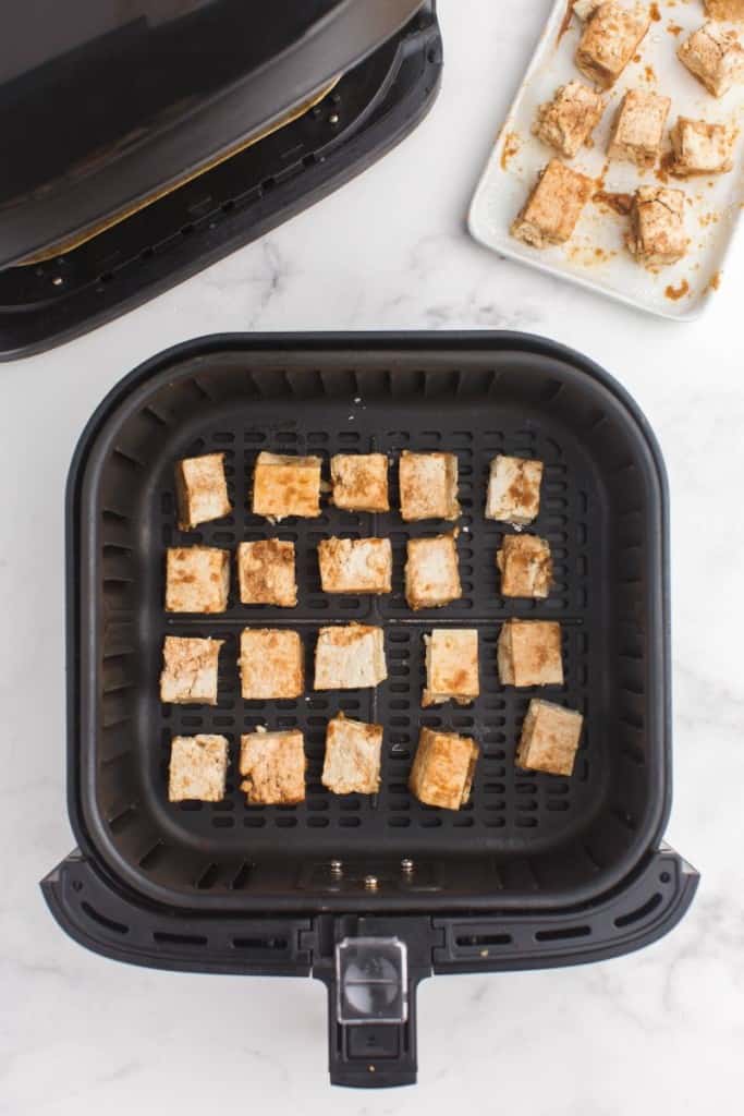 basket with cubes of cut tofu