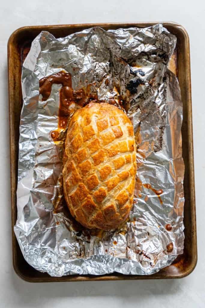 beef wellington on a baking sheet