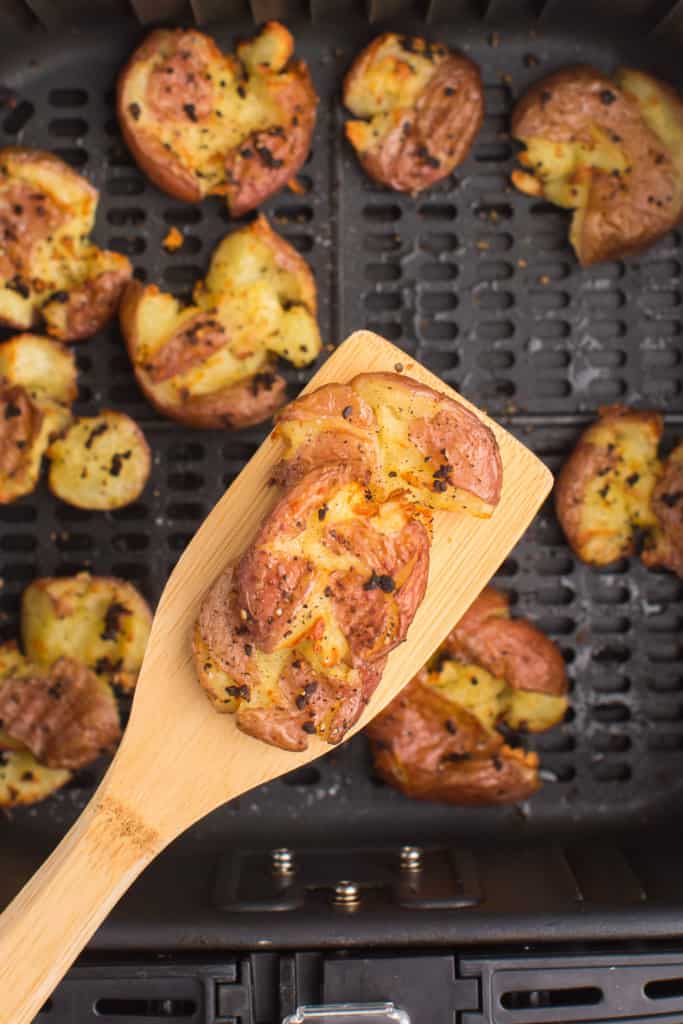 wooden spoon with a smashed potato