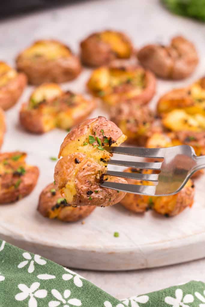 fork with a smashed potato on it