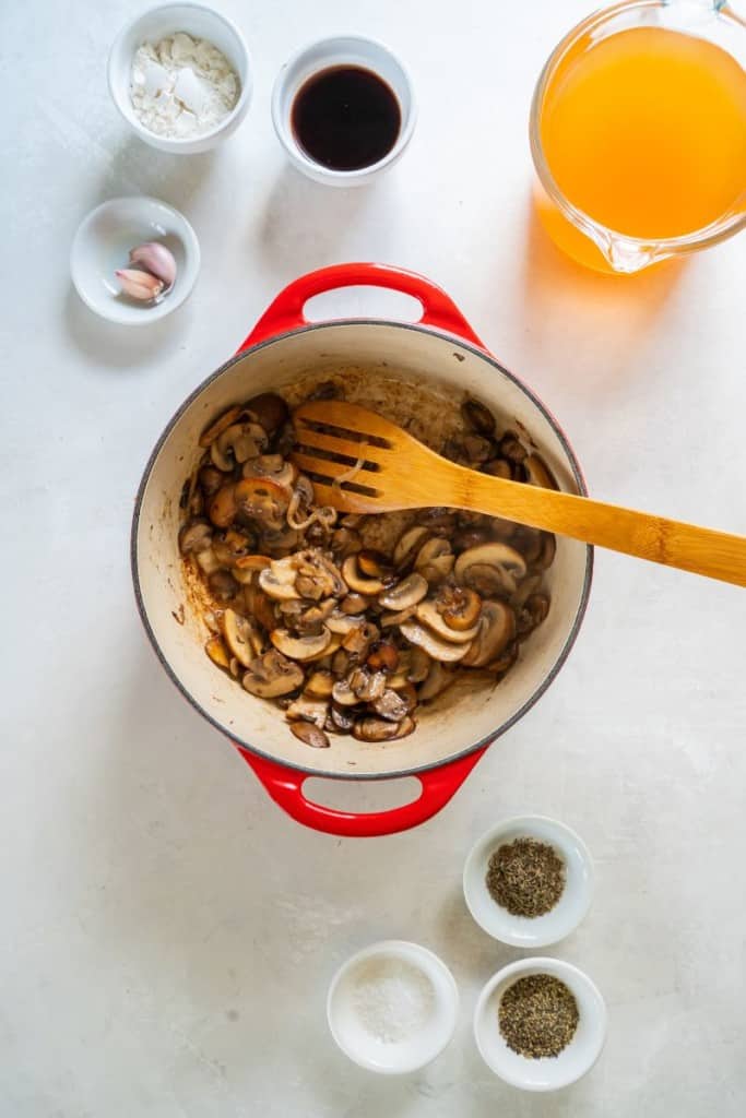 stirring mushrooms and onions