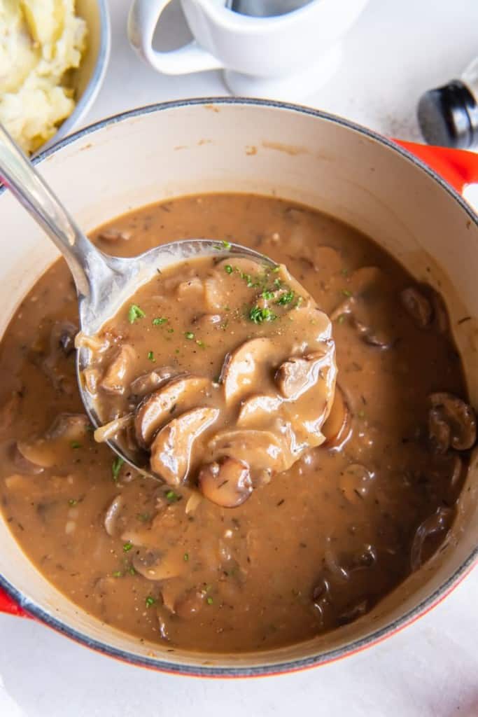 large spoon with mushroom gravy