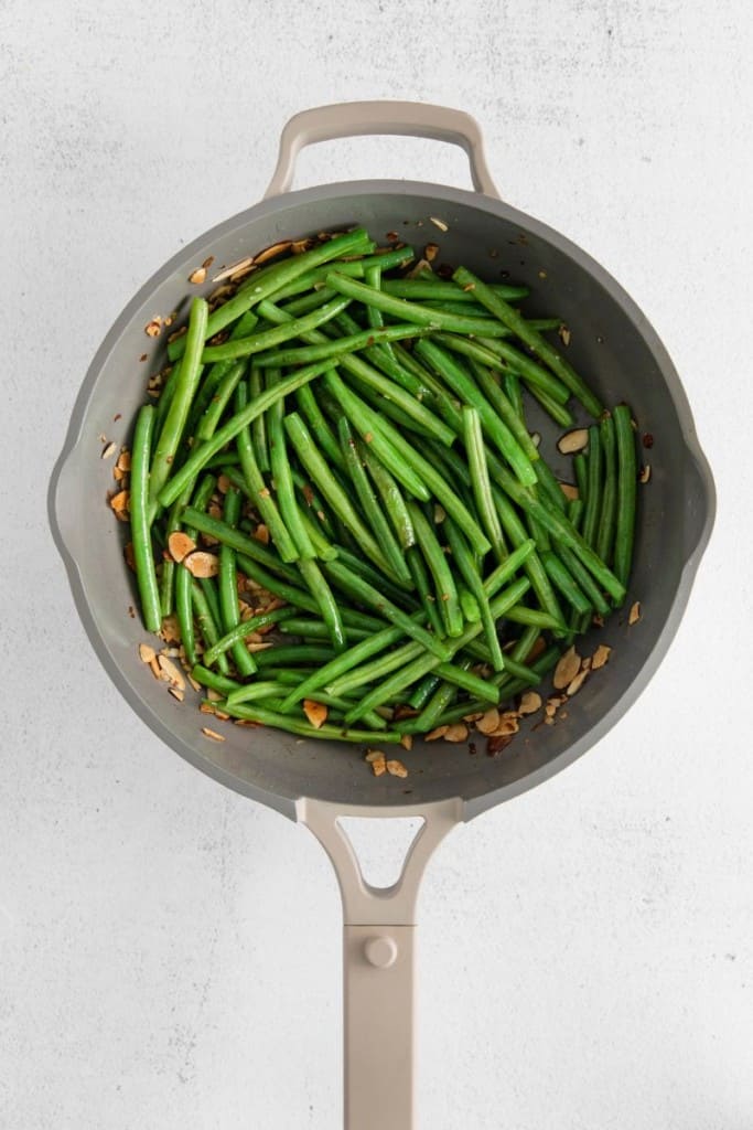 green beans and almonds in a pan