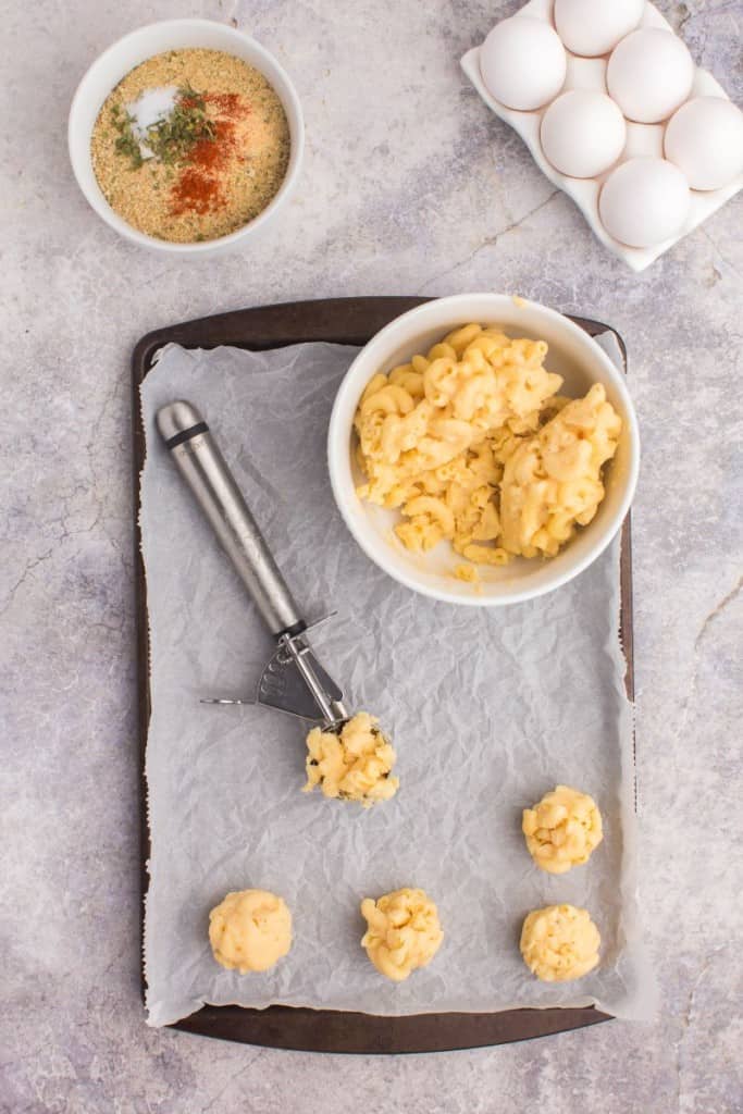 mac and cheese bites in a single layer on a baking sheet