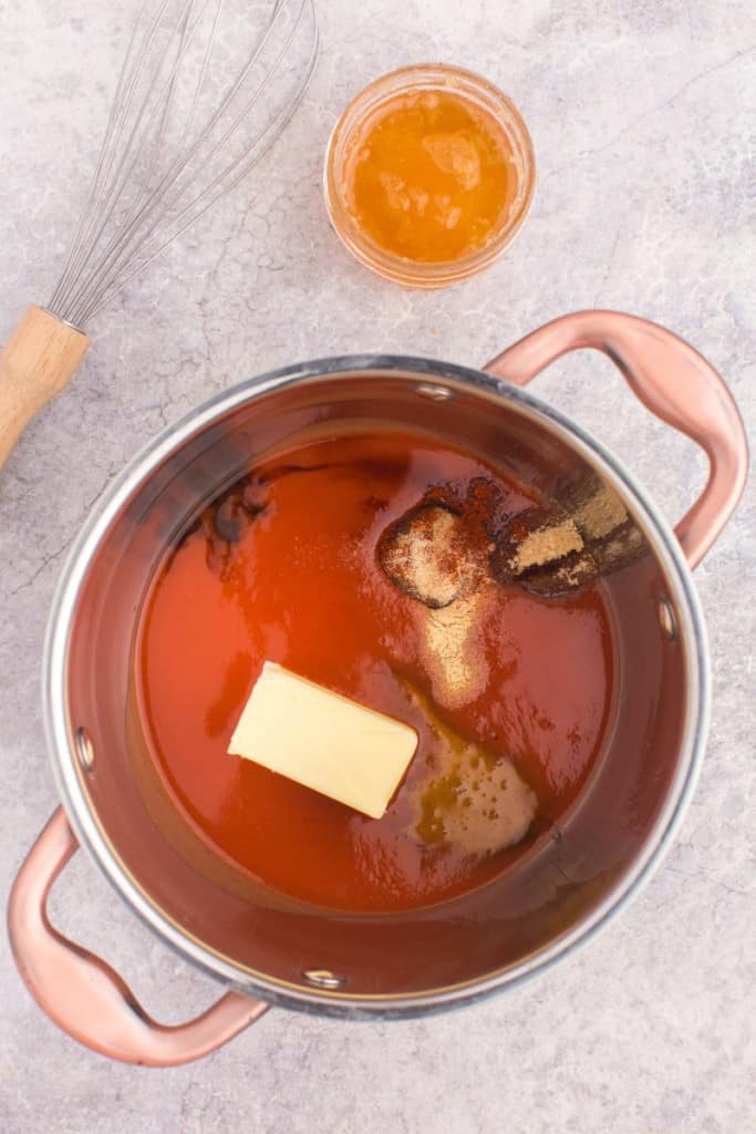 ingredients for honey buffalo wing sauce in pan