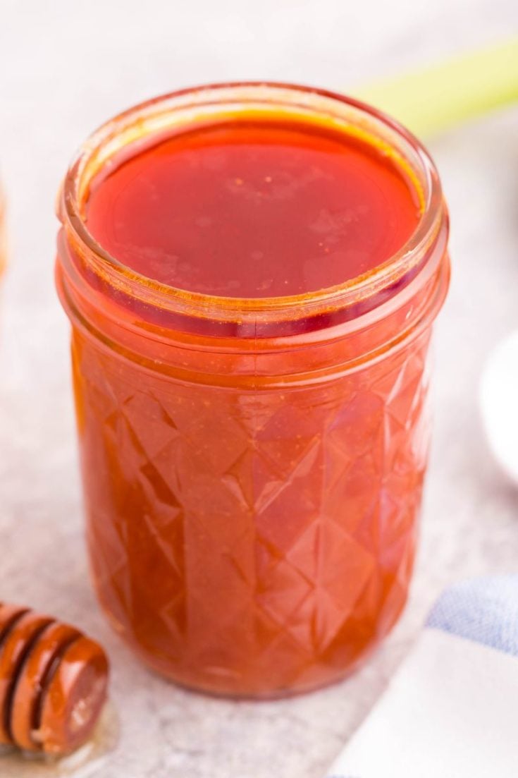 jar filled with honey hot wing sauce