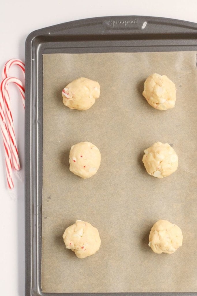 cookie dough balls on a baking sheet